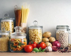 Pantry staples for quick weeknight dinners arranged on a kitchen counter.